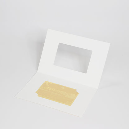 Custom gold foil hole-in-one commemorative card in a white presentation folder